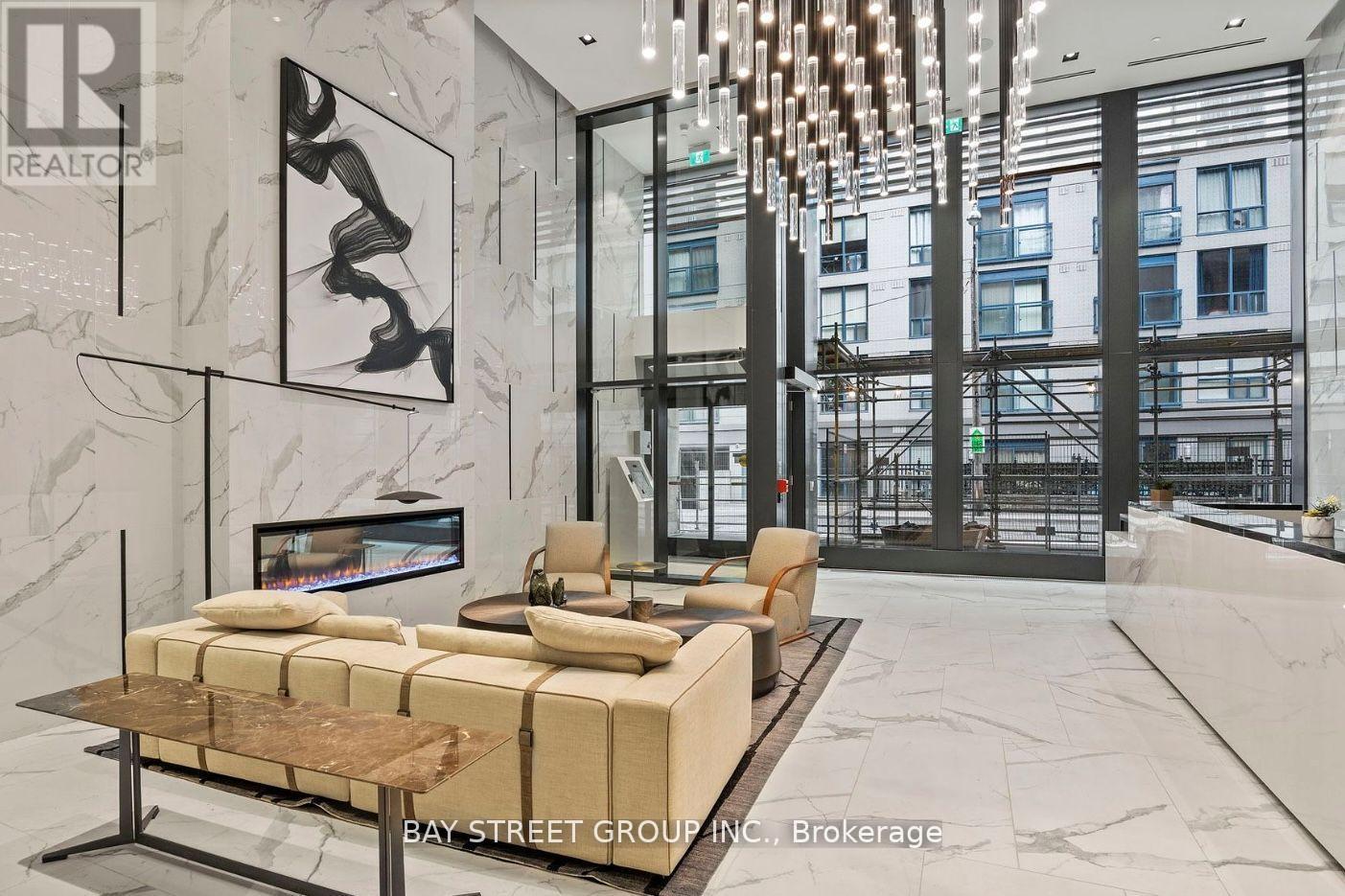 A modern living room with a marble floor and a large window overlooking a cityscape.