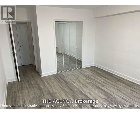 A room with a door and a glass partition wall.