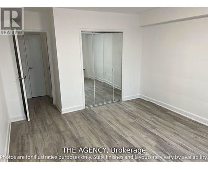 A room with a door and a glass partition wall.