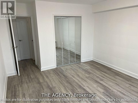 A room with a door and a glass partition wall.