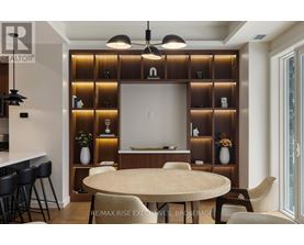A modern dining room with a round table and chairs.