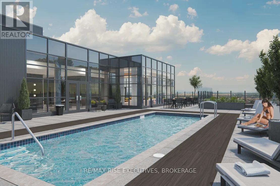 A pool area with a person sitting on a lounge chair.