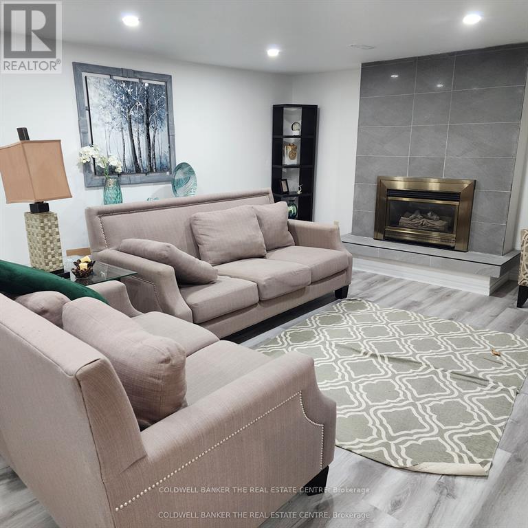 A living room with a fireplace and a couch.