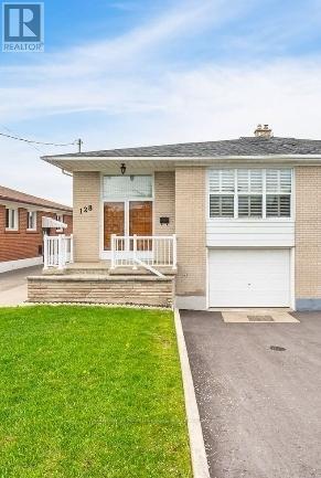 A house with a white garage door is for sale.
