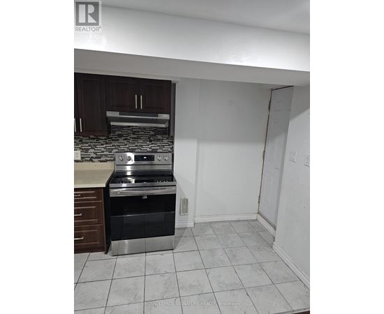 A kitchen with a stove top oven and a microwave.