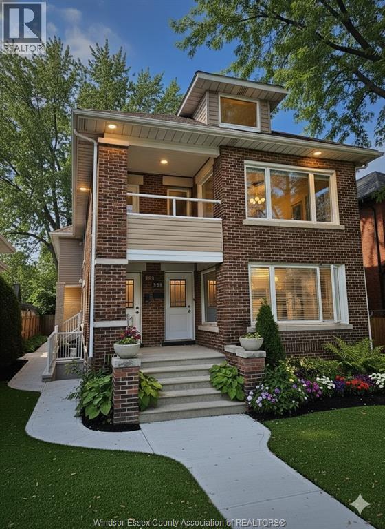 A house with a front yard and a walkway leading to the front door.