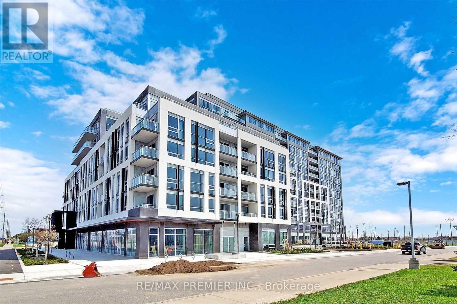 A large, modern building with the RE/MAX logo on the top left corner.
