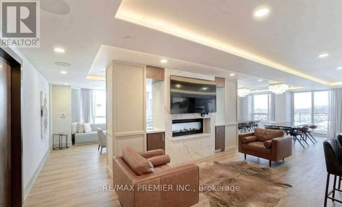 A living room with a large couch and a television.