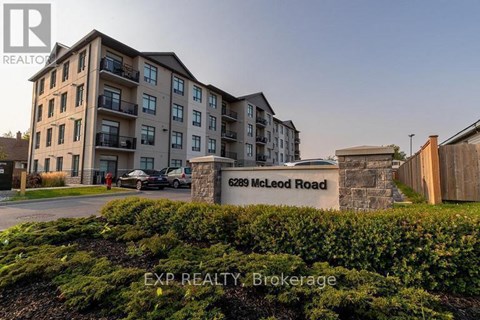 A building with the sign 6289 McLeod Road is shown in the image.