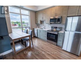 A kitchen with wooden cabinets and stainless steel appliances.