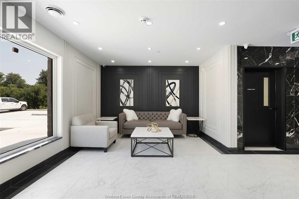 A modern living room with a black and white color scheme.