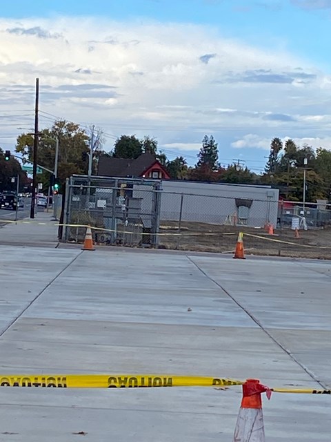 A construction site is cordoned off with yellow caution tape.