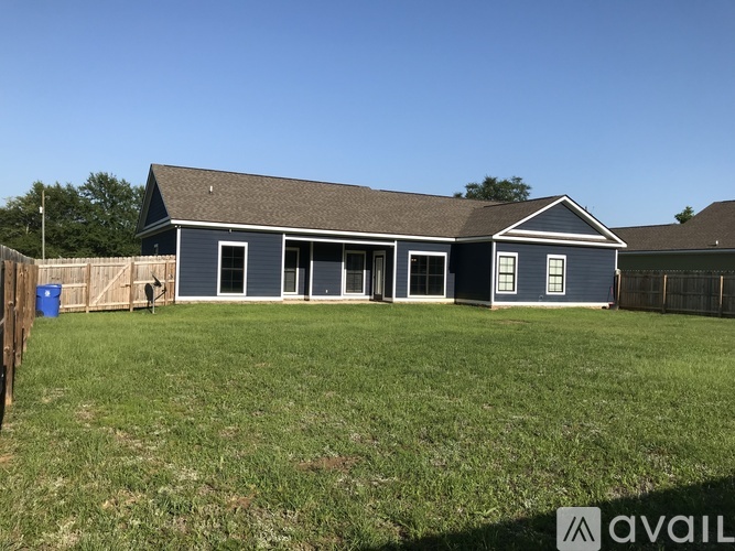 A house with a blue exterior is available for sale.