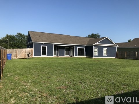 A house with a blue exterior is available for sale.