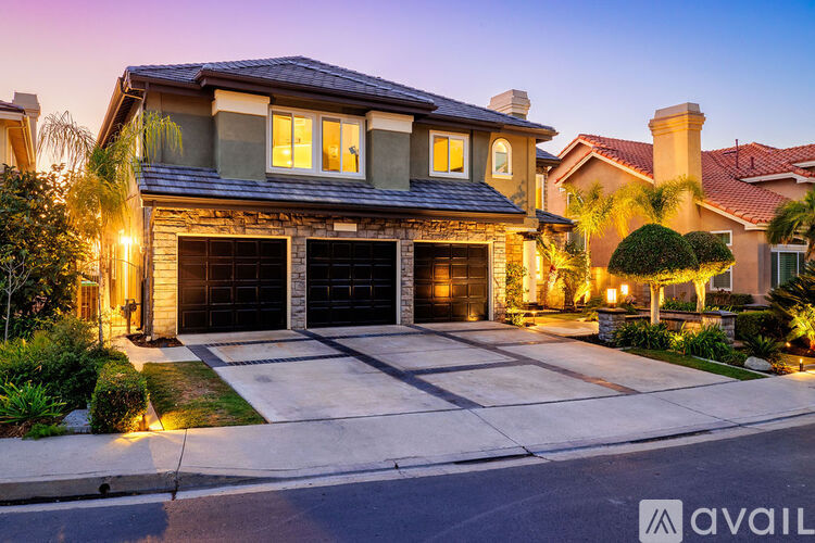 A house with a garage is available for sale.