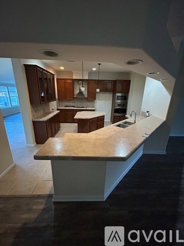 A kitchen with a large island in the middle.