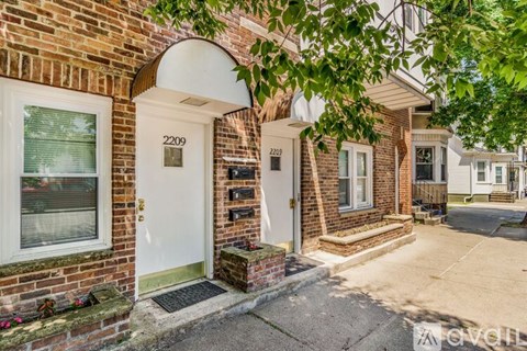 A white door with the number 2209 on it is on the left.