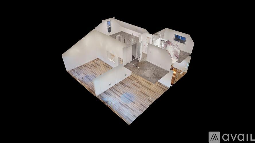 A top-down view of a house interior with a kitchen, living room, and bedrooms.