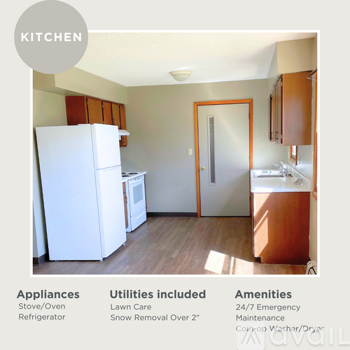 A kitchen with a refrigerator, oven, and microwave.