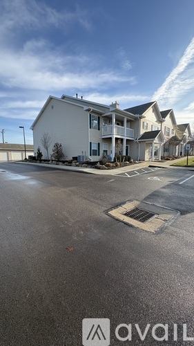A row of houses with a sign that says "available" in the foreground.