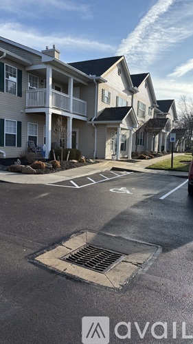 A row of houses with a sign that says "available" in the foreground.