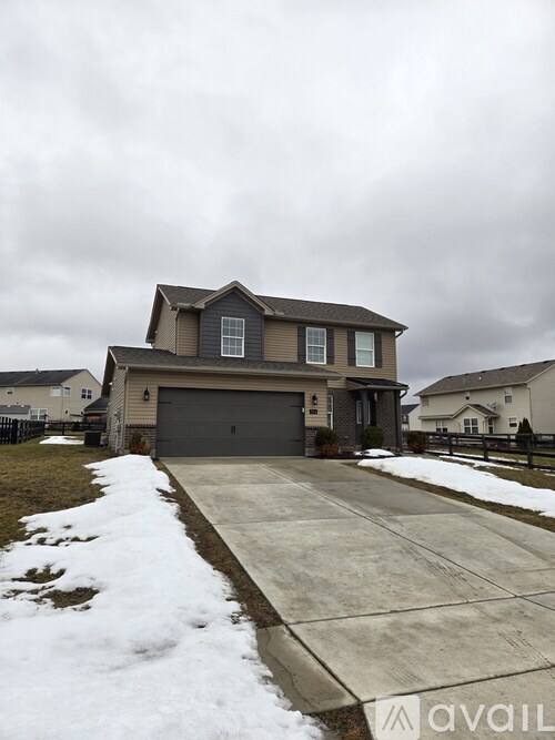A house with a driveway in front of it.