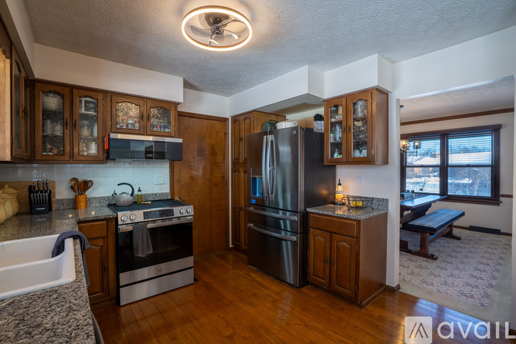 A kitchen with wooden cabinets and stainless steel appliances.