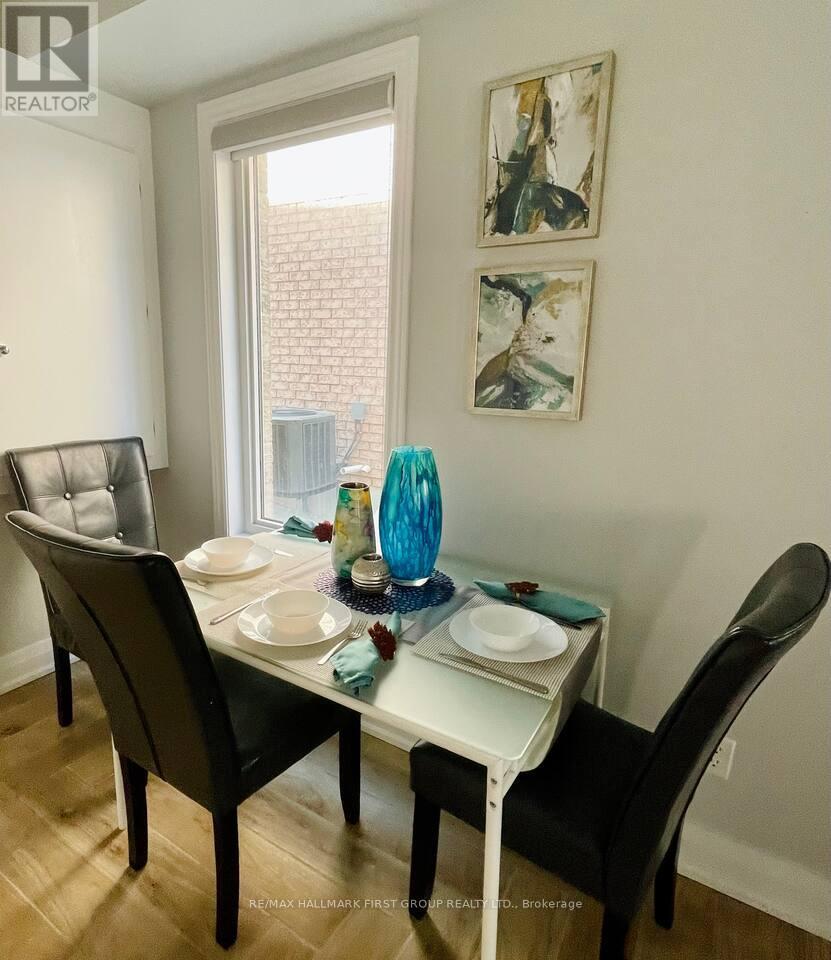 A dining room with a table set for two.