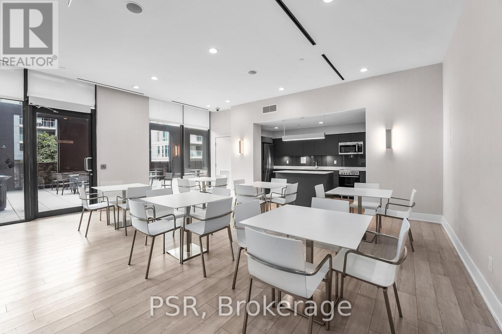 A dining room with a table set for four.
