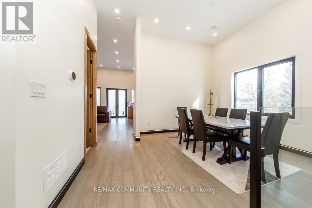 A dining room with a table set for four.