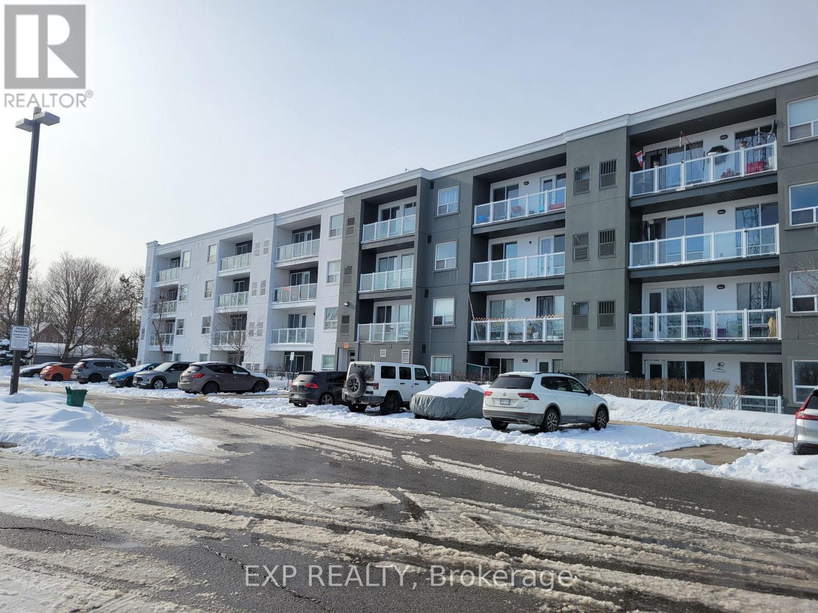 A building with the text EXP REALTY, Brokerage on the bottom.