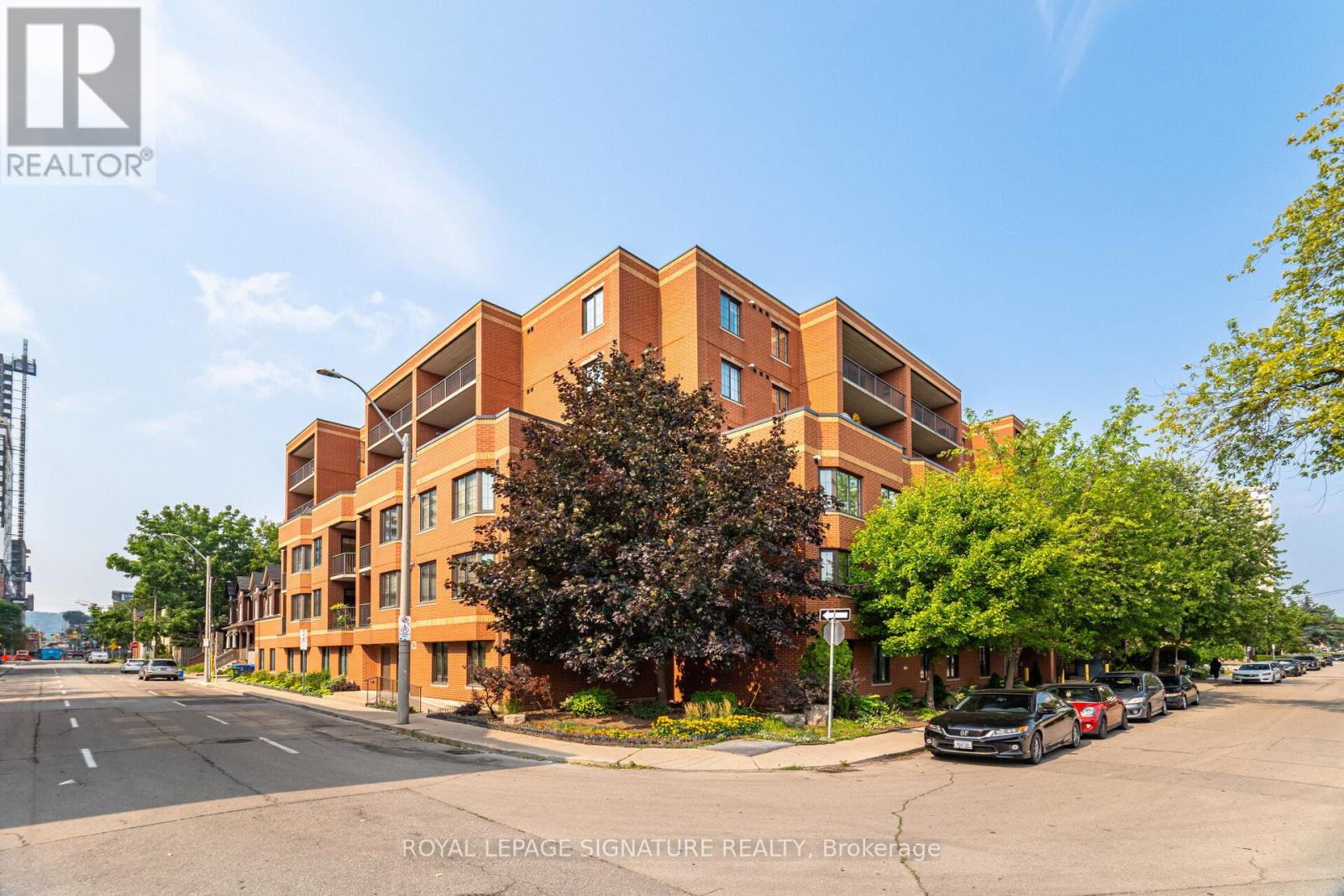 A modern apartment building with a clear blue sky above.