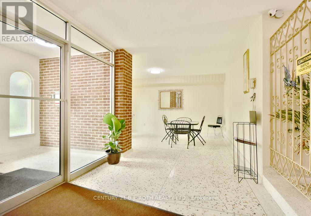 A living room with a glass door leading to a balcony.