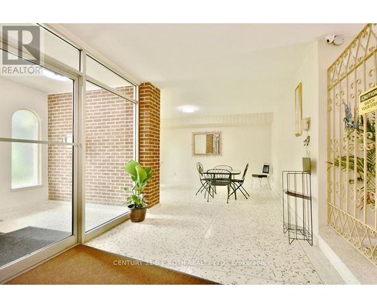 A living room with a glass door leading to a balcony.