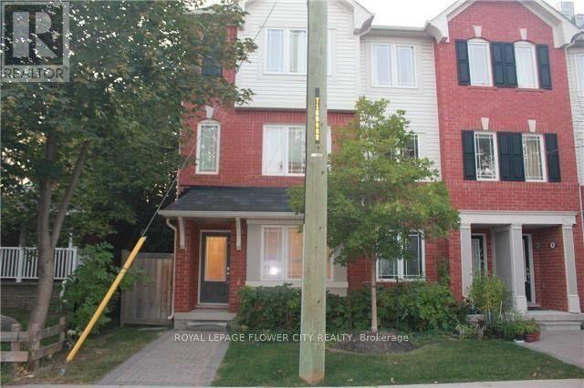 A house with a red and white facade is for sale.