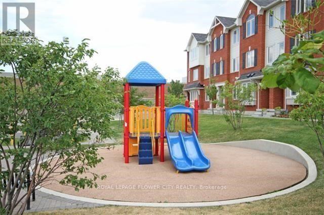 A playground with a blue slide and a yellow slide.