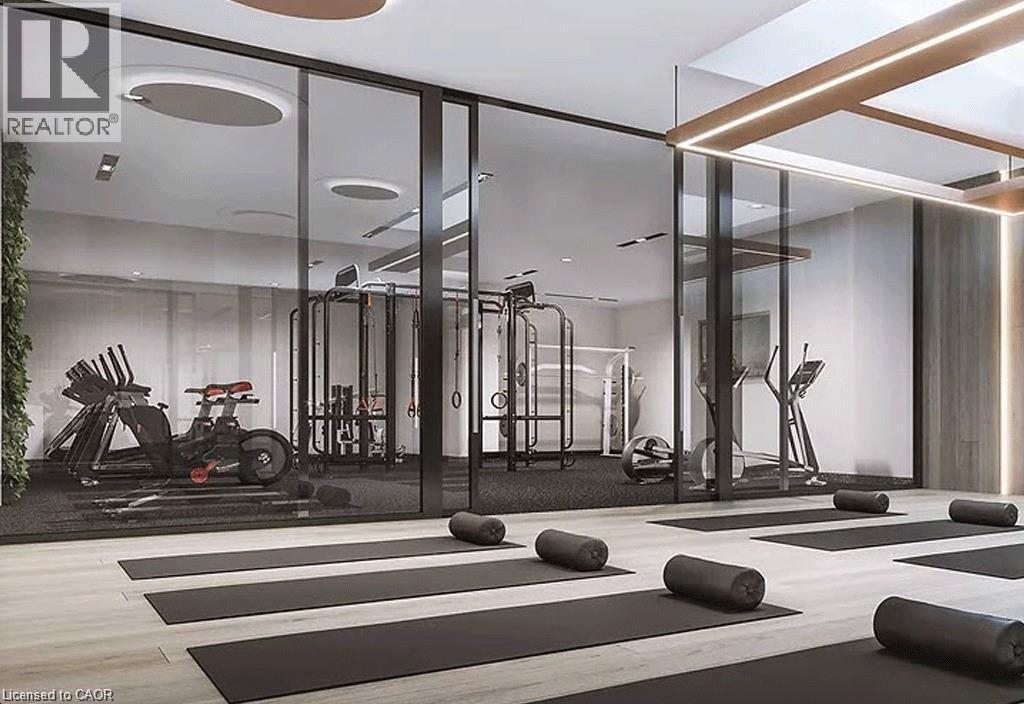 A modern gym with a variety of equipment including a treadmill, weights, and a bench press.