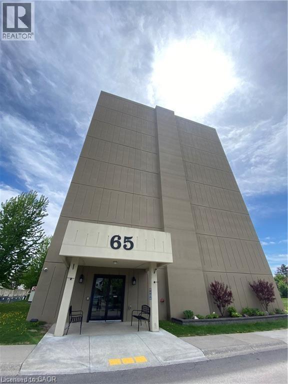 The building number 65 is visible in front of the building.
