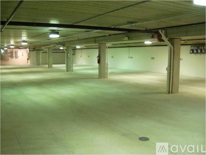 A spacious, empty parking garage with concrete floors and multiple levels.