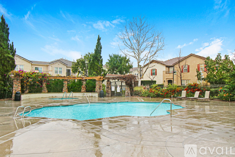 A pool surrounded by a residential area.