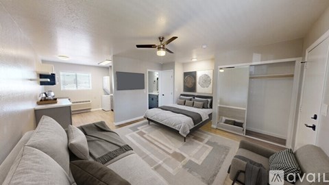 A spacious bedroom with a large bed and a couch.
