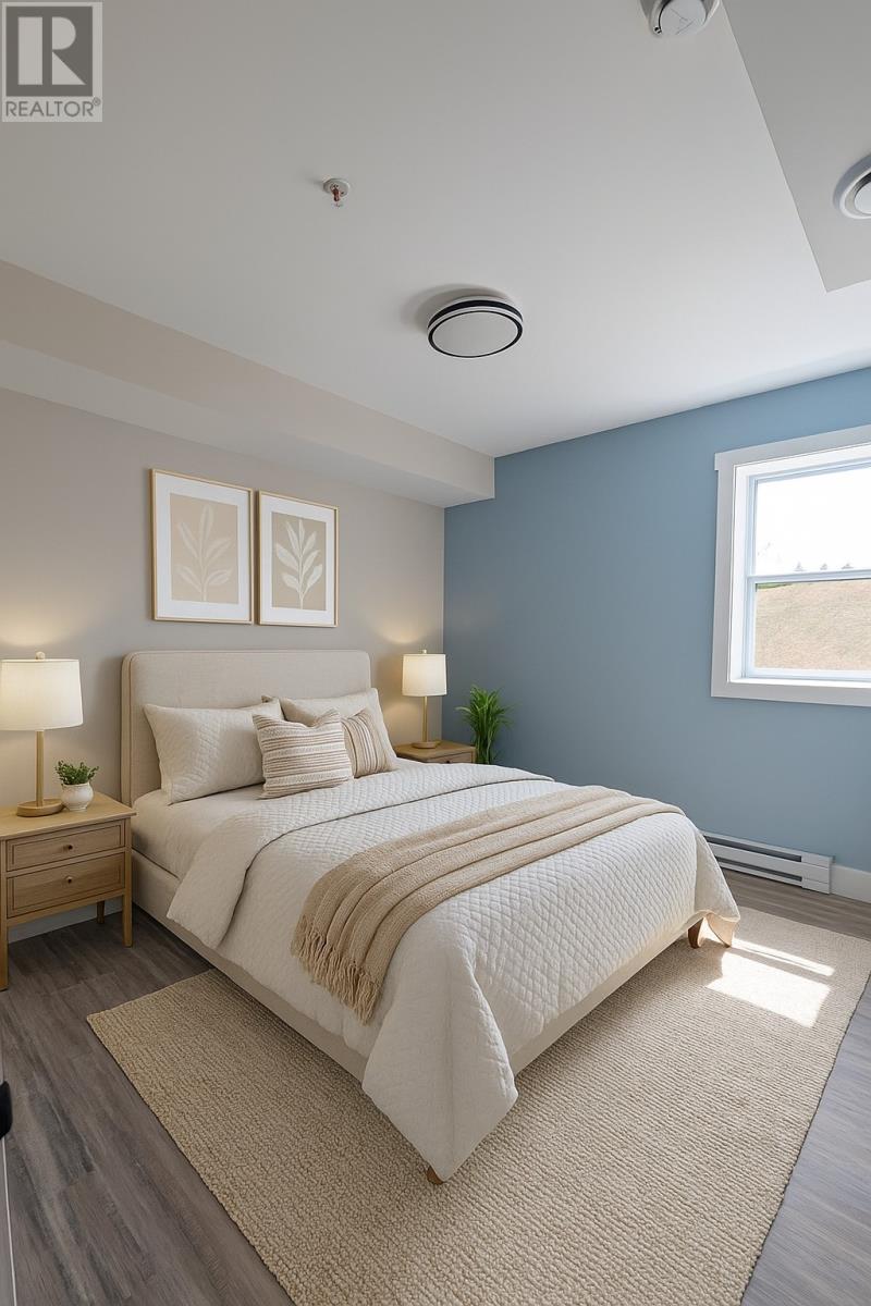 A bedroom with a large bed, two lamps, and two framed pictures on the wall.