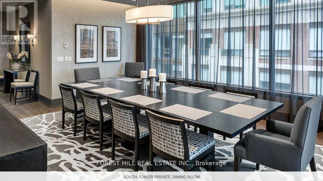 A dining room with a table set for six with chairs around it.