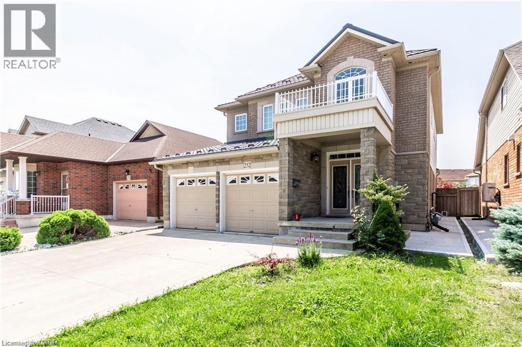 A large house with a garage is for sale.