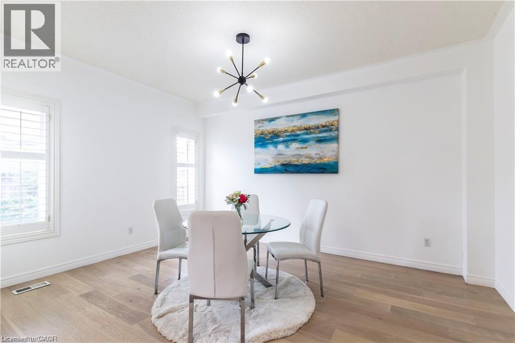 A dining room with a table set for two.