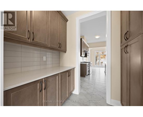 A kitchen with wooden cabinets and a white countertop.