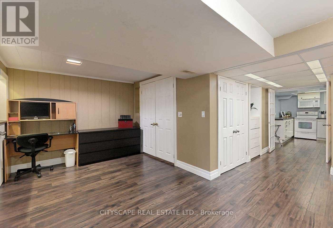 A real estate listing image of a kitchen and dining area.