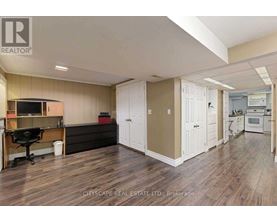 A real estate listing image of a kitchen and dining area.