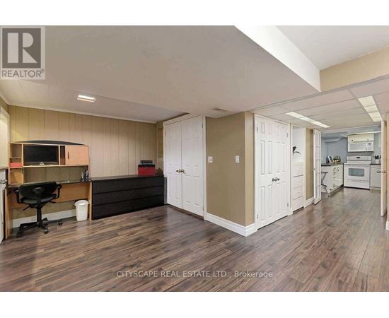 A real estate listing image of a kitchen and dining area.