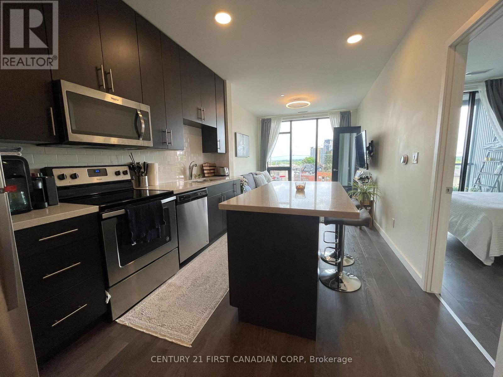A kitchen with a large island in the middle of the room.